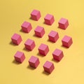 Pink wooden blocks on a yellow background. Modern conceptual art.