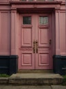 pink wooden door on old victorian house ai generated Royalty Free Stock Photo