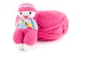 Pink wool ball with selfmade knitted doll