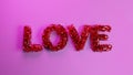 The pink word LOVE explodes into a small particles