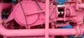 Pink work equipment on a very large generator engine Royalty Free Stock Photo