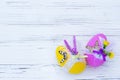Pink and yellow decorated Easter eggs on the wooden table Royalty Free Stock Photo