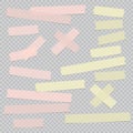 Pink and yellow different size adhesive, sticky, masking, tape, paper pieces are on grey squared background Royalty Free Stock Photo