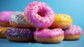 Pink, yellow donut banner. Closeup sweet donuts dessert decorated with colorful sprinkles isolated on blue color background.