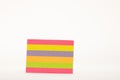 Pink, yellow, and green striped paper piece Royalty Free Stock Photo