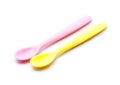 Pink and yellow silicone baby spoon