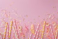 Pink and Yellow Striped Straws With Confetti and Streamers Royalty Free Stock Photo