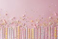 Pink and Yellow Striped Straws With Confetti and Streamers Royalty Free Stock Photo