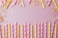 Pink and Yellow Striped Straws With Confetti and Streamers Royalty Free Stock Photo