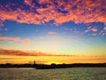 Pink and yellow sunset, sea and colours in the touristic harbor of Civitanova Marche Royalty Free Stock Photo