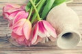 Pink and yellow tulips and vase Royalty Free Stock Photo