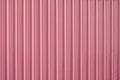 Pink zinc metal corrugated fence,metalsheet fence for background Royalty Free Stock Photo