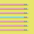 Pinks and one blue pencils on yellow background. flat lay Royalty Free Stock Photo