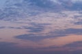 Pinky sunset sky with soft gray or blue clouds. Background image Royalty Free Stock Photo