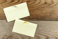 A pinned piece of paper hangs on a wooden wall Royalty Free Stock Photo