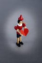 Pinocchio liar holding heart