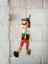 Pinocchio wooden puppets look like they are walking hovering
