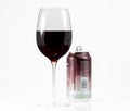 Pinot Noir red wine in wine glass with a single serve aluminum can in background Royalty Free Stock Photo