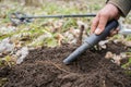 Pinpointer metal detector in hand. Search coins with a pinpointer