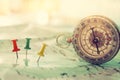 pins attached to map, showing location or travel destination and old compass. Royalty Free Stock Photo