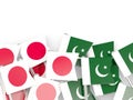 Pins with flags of Japan and pakistan isolated on white