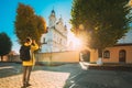 Pinsk, Brest Region, Belarus. Young Woman Tourist Lady Photograph Taking Pictures Near Cathedral Of Name Of The Blessed
