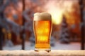 A pint of beer with beer head, view of pine trees and snow, close up shot with copy space, no people, holiday and drinks concept.