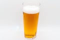 Pint of cold lager beer in a glass and isolated on a white background Royalty Free Stock Photo