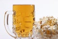 Pint of cold light beer and salty popcorn Royalty Free Stock Photo