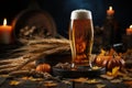 A pint of foaming beer in a glass, ears of barley on a blurred autumn background