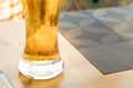 Pint or glass of beer on a table in a cafe or bar. Copy space background. Lager light filtered beer Royalty Free Stock Photo