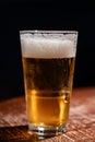 Pint glass of cold fresh british ale and lager beer served in old vintage English pub Royalty Free Stock Photo