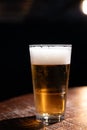 Pint glass of cold fresh british ale and lager beer served in old vintage English pub Royalty Free Stock Photo