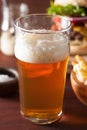 Pint glass of india pale ale beer and fastfood Royalty Free Stock Photo