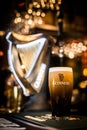 Pint of Guinness beer on a pub`s counter