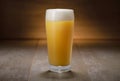 A pint of IPA, hazy unfiltered juicy draft NEIPA beer on wooden background