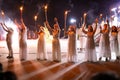 PINTO,MADRID, SPAIN - JUNE 23, 2019: People celebrate St John`s Eve around a bonfire with Iris Witches in a village in Spain. St