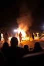 PINTO,MADRID, SPAIN - JUNE 23, 2019: People celebrate St John`s Eve around a bonfire with Iris Witches in a village in Spain. St