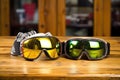 pints of beer next to ski goggles on a wooden table Royalty Free Stock Photo