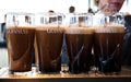 Pints of Guinness are being served in a pub in Dublin, Ireland - February 15, 2014