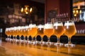 pints of saison beer lined up on a bar table Royalty Free Stock Photo