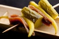 Pintxo Gilda Basque of chilli peppers, anchovy and cucumber. Royalty Free Stock Photo