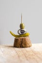 Pintxos Pintxo, Olive, Anchovy, Green Guindilla on a Rustic Board, food from the Basque Country Royalty Free Stock Photo