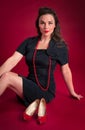 Pinup Girl Poses with Vintage Red Shoes