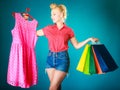 Pinup girl with shopping bags buying clothes dress Royalty Free Stock Photo