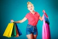 Pinup girl with shopping bags buying clothes dress Royalty Free Stock Photo