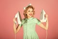 Pinup woman hold iron, retro style, maid. Royalty Free Stock Photo