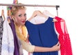 Pinup woman showing dresses on hanger