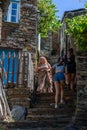 View at the tourist people going up the schist stairs on PiodÃÂ£o village, a typical and traditional schist village Royalty Free Stock Photo