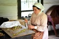 Pioneer Woman Stringing Rhubarb Pieces to Dry